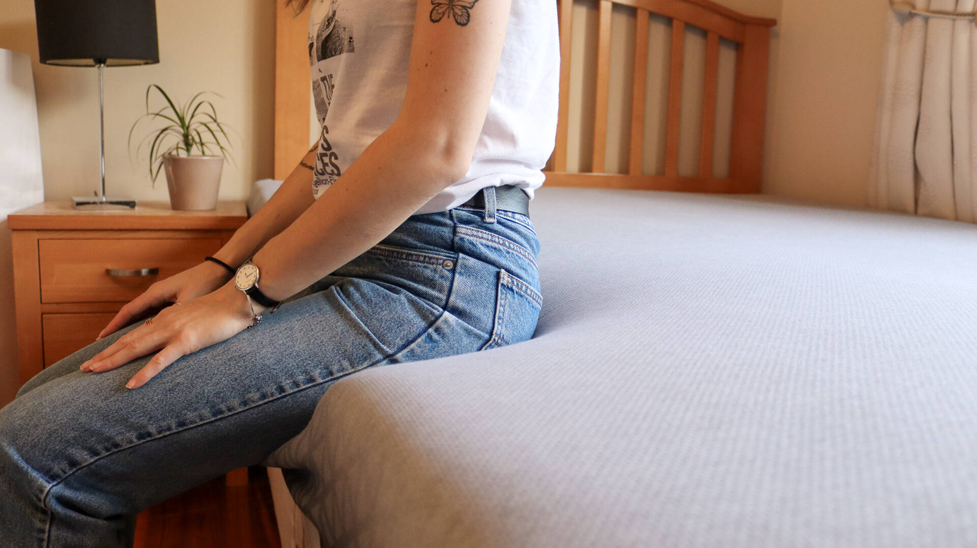 sitting on the edge of the zoma mattress